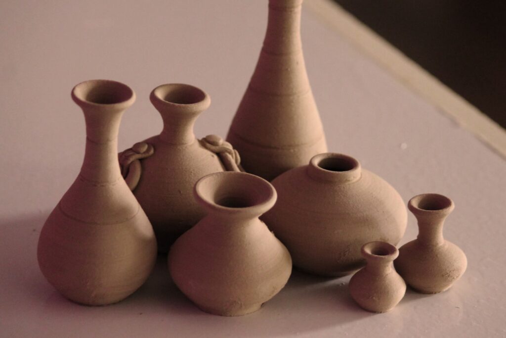 white clay vases on table
